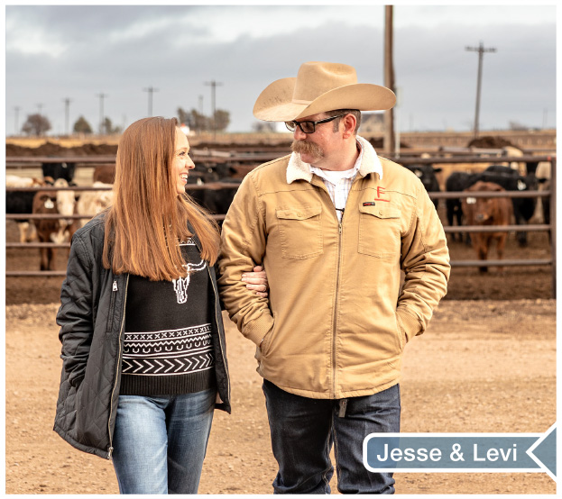 Jesse and Levi Berry walking towards camera from a cattle pen