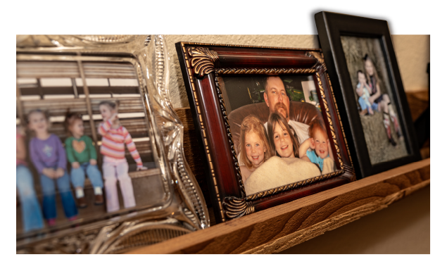 Family photos on a shelf when the girls were younger