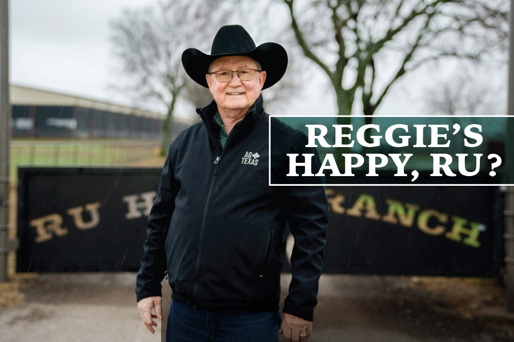 Reggie Underwood wearing a black cowboy hat and black jacket. He stands in front of his gate that reads, "RU Happy Ranch".